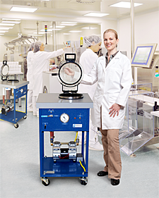 photo of a woman with a portable vacuum pump degassing system